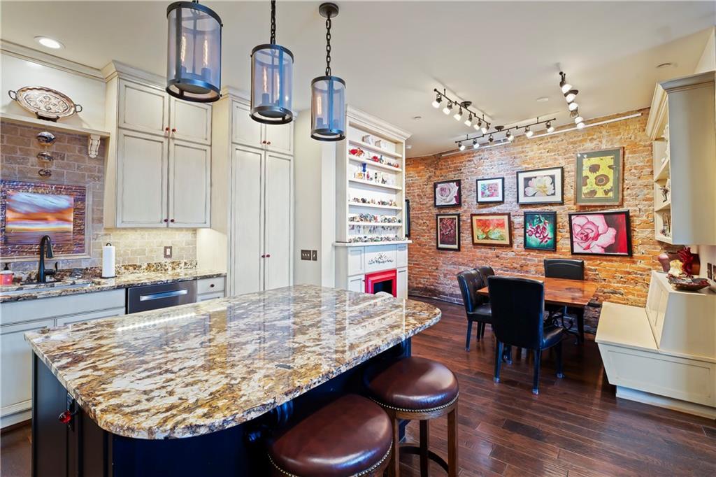 4119 Butler Street Pittsburgh, PA 15201 - Photo 7 of 23 a living room with kitchen island granite countertop furniture and wooden floor