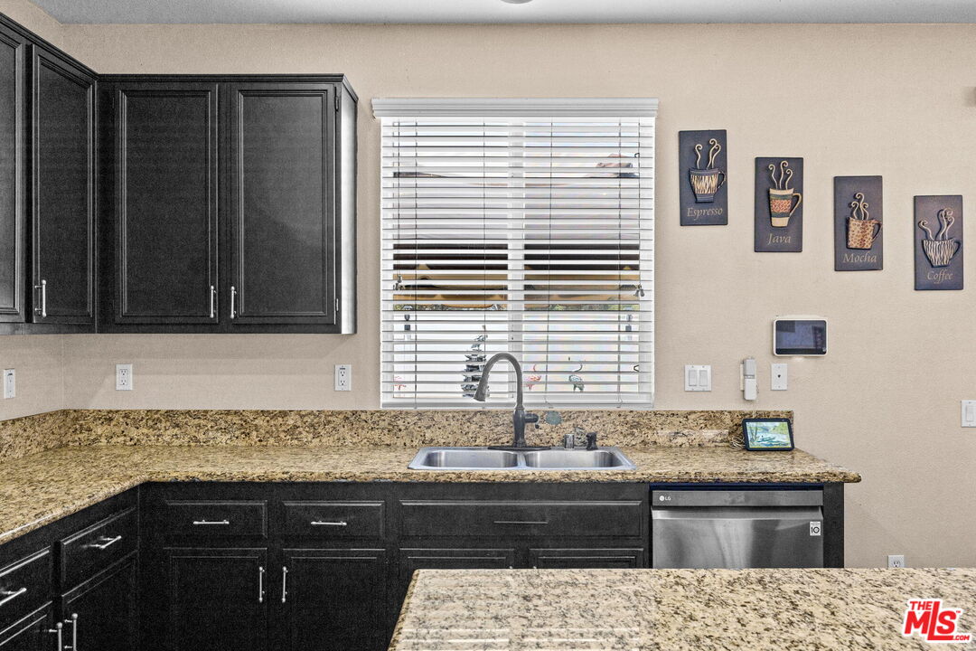 26692 Rim Creek Path Menifee, CA 92584 - Photo 13 of 41 a kitchen with a sink and a window