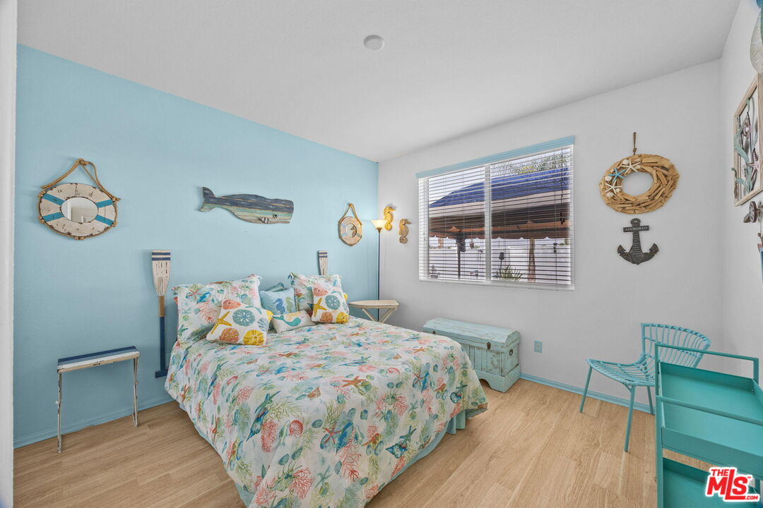 26692 Rim Creek Path Menifee, CA 92584 - Photo 14 of 41 a bedroom with a bed and a window