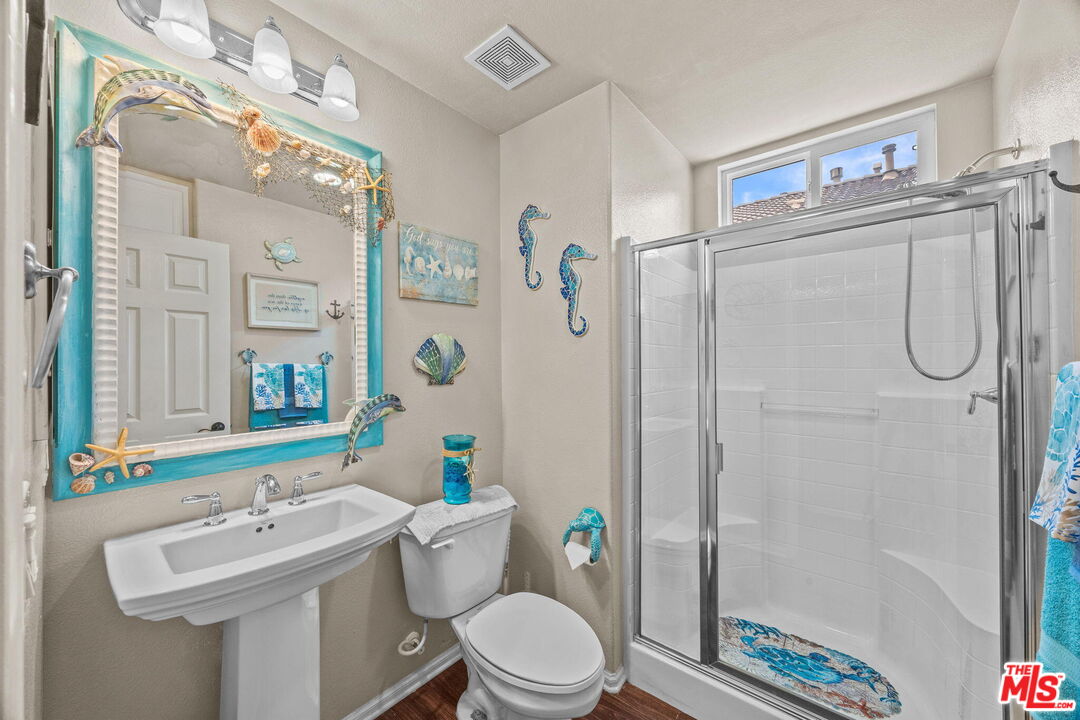 26692 Rim Creek Path Menifee, CA 92584 - Photo 15 of 41 a bathroom with a sink toilet and shower