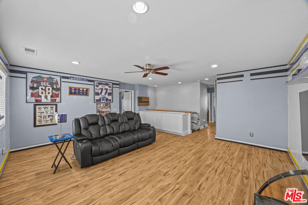 26692 Rim Creek Path Menifee, CA 92584 - Photo 17 of 41 a living room with furniture and wooden floor