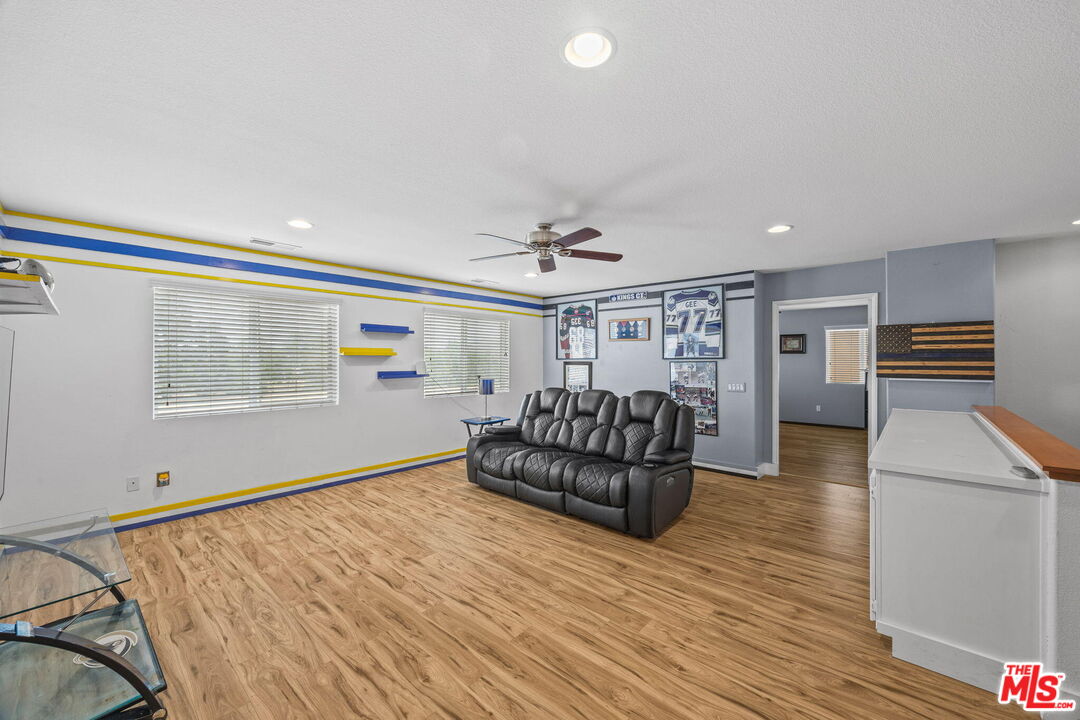 26692 Rim Creek Path Menifee, CA 92584 - Photo 18 of 41 a view of livingroom with furniture and wooden floor