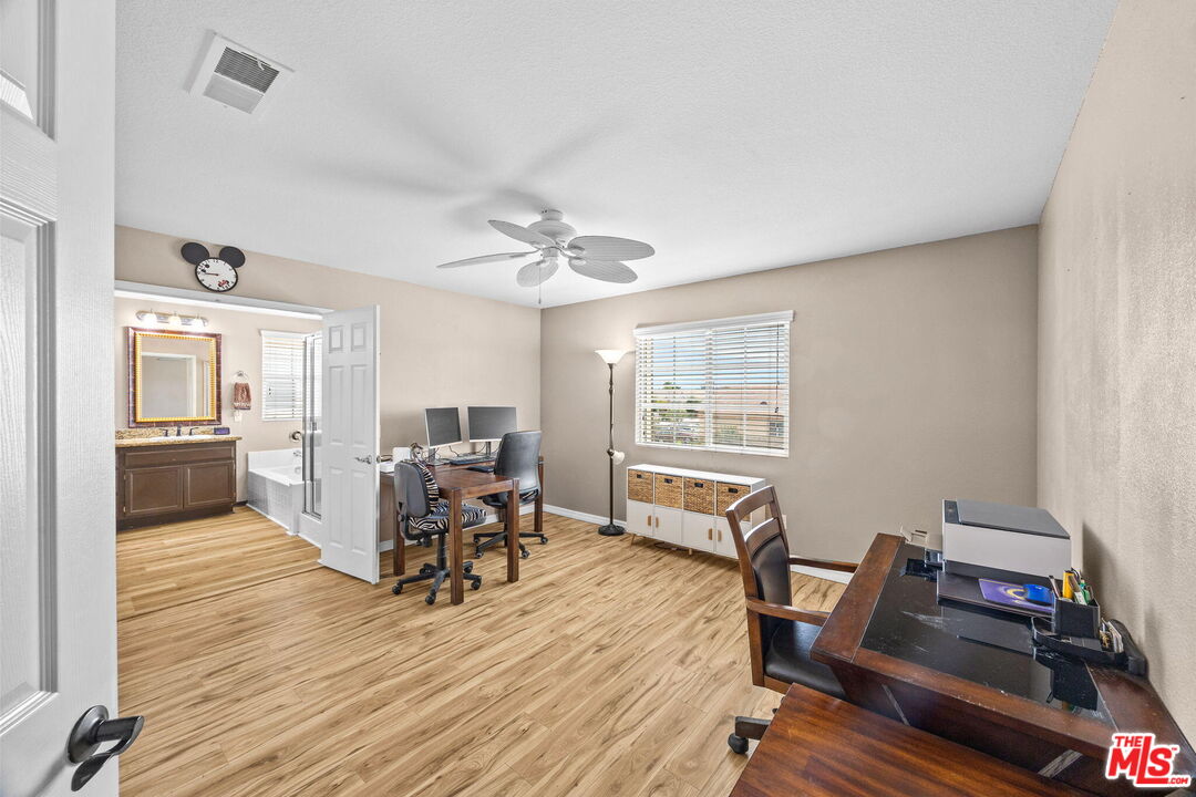 26692 Rim Creek Path Menifee, CA 92584 - Photo 25 of 41 a living room with furniture and a wooden floor