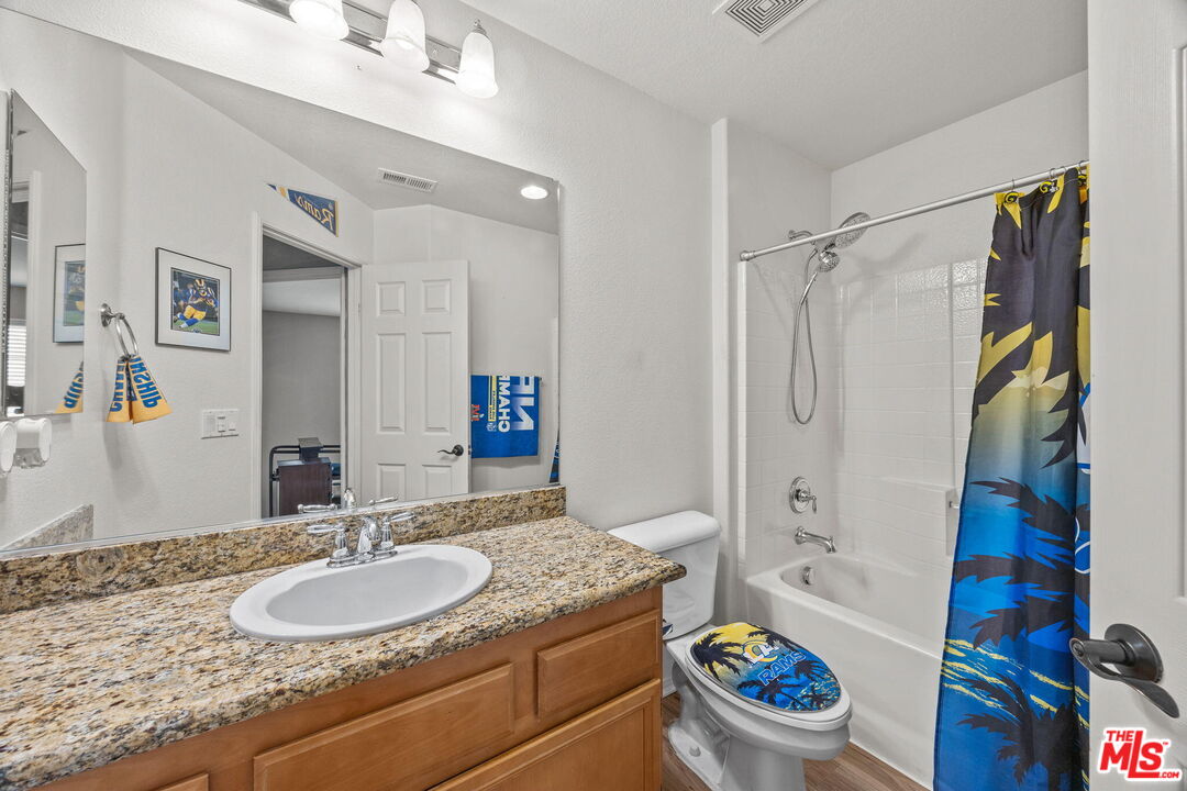 26692 Rim Creek Path Menifee, CA 92584 - Photo 26 of 41 a bathroom with a sink toilet and shower