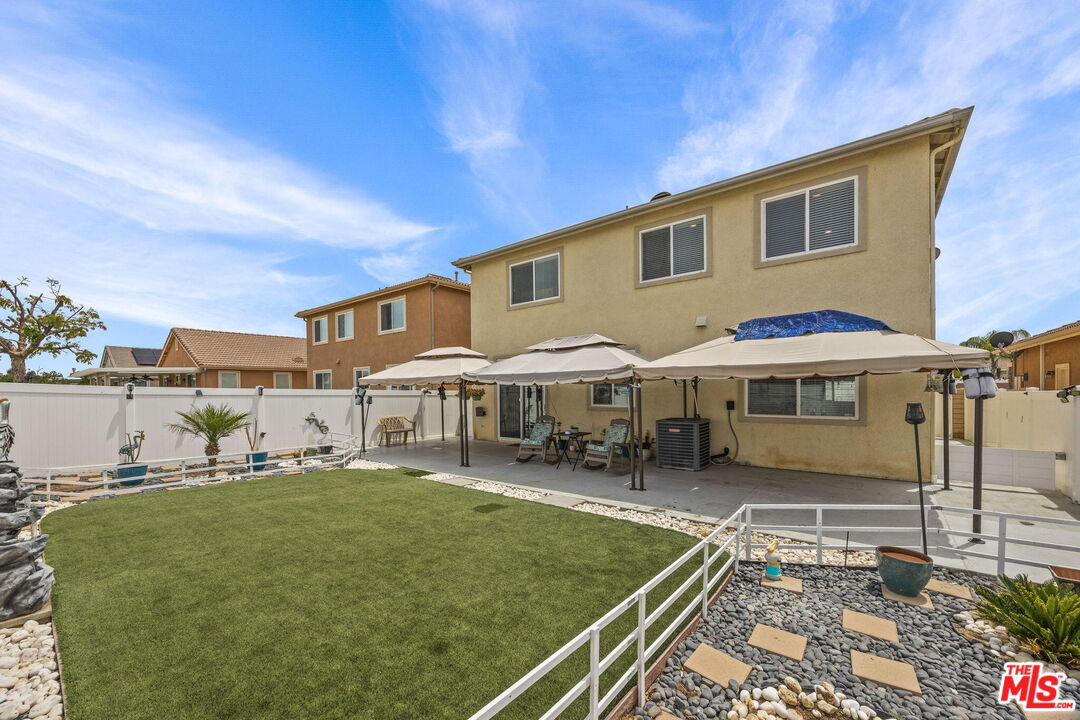 26692 Rim Creek Path Menifee, CA 92584 - Photo 31 of 41 a front view of a house with garden