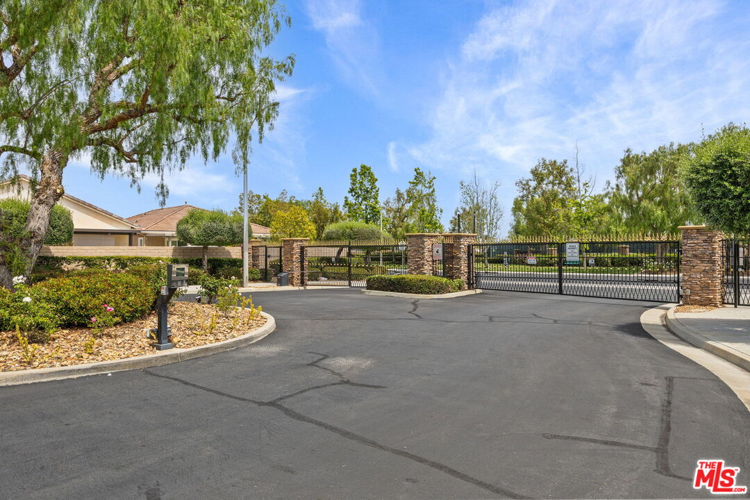 26692 Rim Creek Path Menifee, CA 92584 - Photo 37 of 41 a view of a road with wooden fence