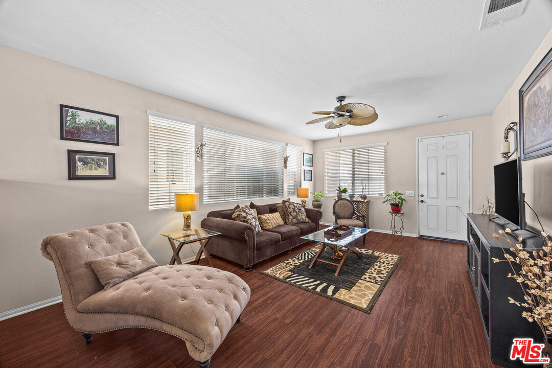 26692 Rim Creek Path Menifee, CA 92584 - Photo 5 of 41 a living room with furniture and a flat screen tv