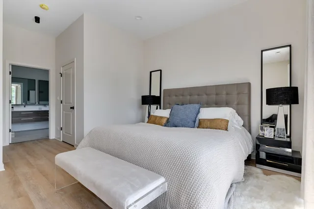 a bedroom with a bed and a television