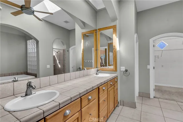 a bathroom with a granite countertop sink a mirror and a