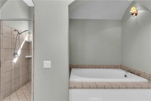 a kitchen with stainless steel appliances granite countertop a sink a stove and white cabinets