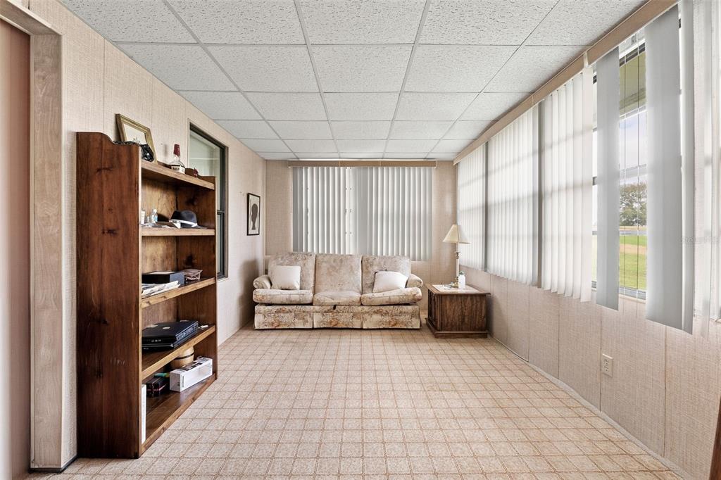 2673 Cayman Circle, Unit R38 Zellwood, FL 32798 - Photo 11 of 63 a living room with furniture and a large window