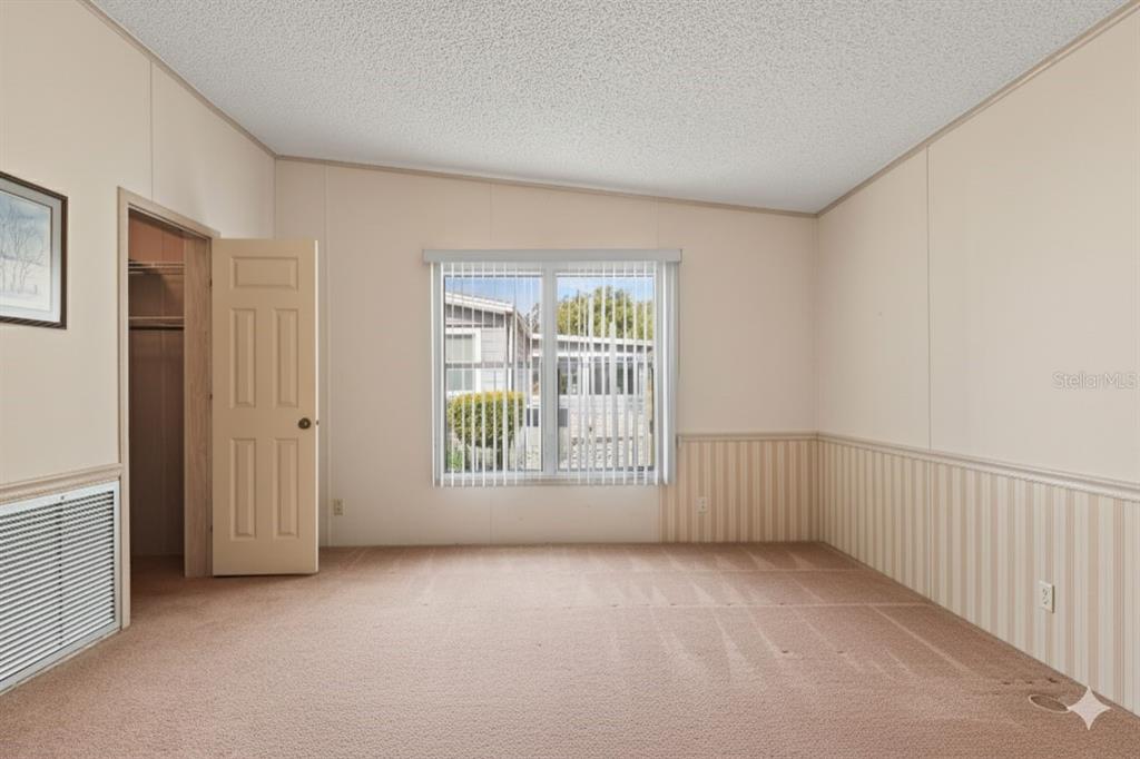 2673 Cayman Circle, Unit R38 Zellwood, FL 32798 - Photo 13 of 63 an empty room with a window