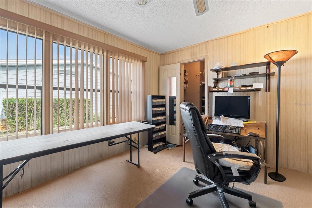 2673 Cayman Circle, Unit R38 Zellwood, FL 32798 - Photo 14 of 63 a view of a workspace with furniture and a window
