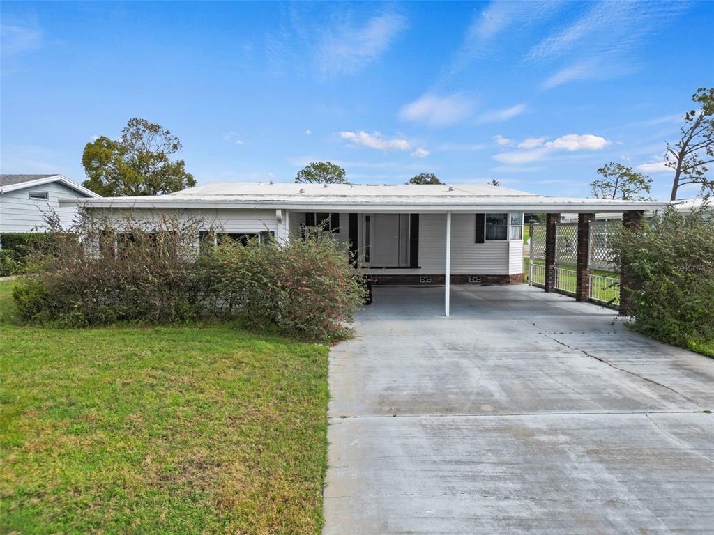 2673 Cayman Circle, Unit R38 Zellwood, FL 32798 - Photo 22 of 63 a view of a backyard with plants and outdoor seating