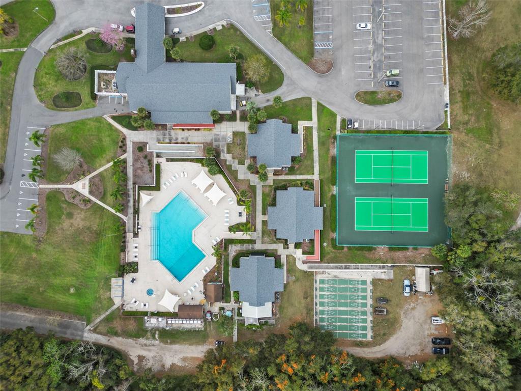 2673 Cayman Circle, Unit R38 Zellwood, FL 32798 - Photo 26 of 63 an aerial view of a house with a garden and trees