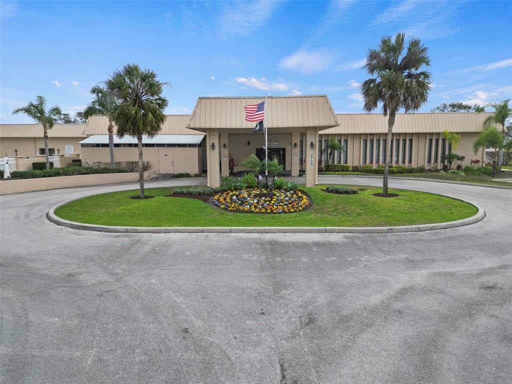 2673 Cayman Circle, Unit R38 Zellwood, FL 32798 - Photo 42 of 63 a front view of a house with garden