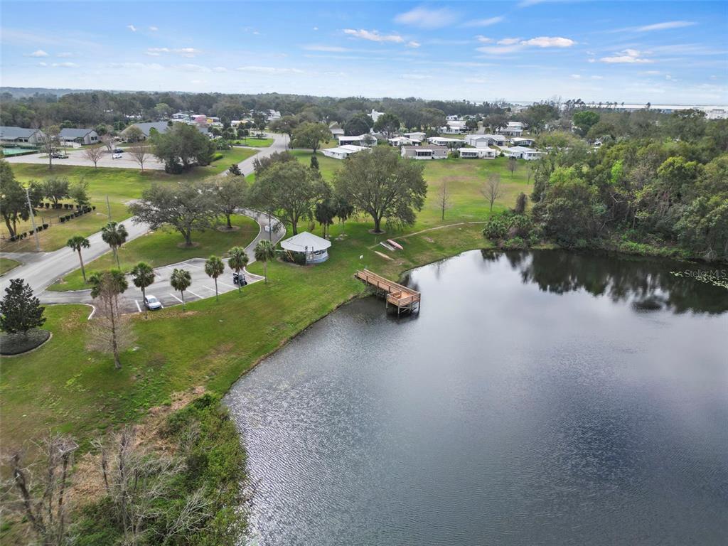 2673 Cayman Circle, Unit R38 Zellwood, FL 32798 - Photo 55 of 63 a view of a lake with houses