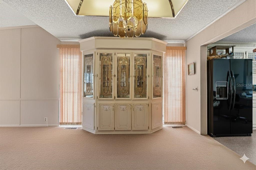 2673 Cayman Circle, Unit R38 Zellwood, FL 32798 - Photo 8 of 63 a view of an empty room with a window