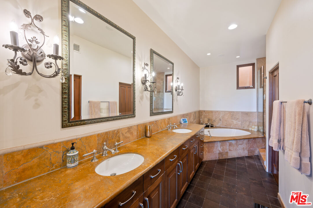 3854 Rambla Orienta Malibu, CA 90265 - Photo 15 of 33 a bathroom with a double vanity sink and a mirror