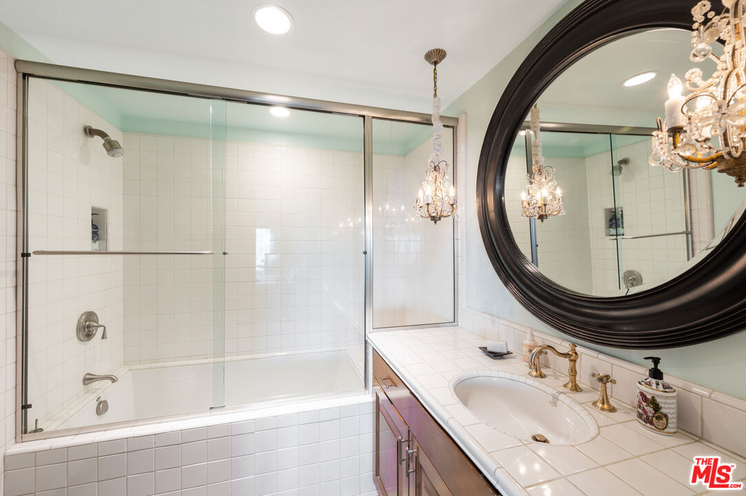 3854 Rambla Orienta Malibu, CA 90265 - Photo 21 of 33 a bathroom with a sink and a mirror