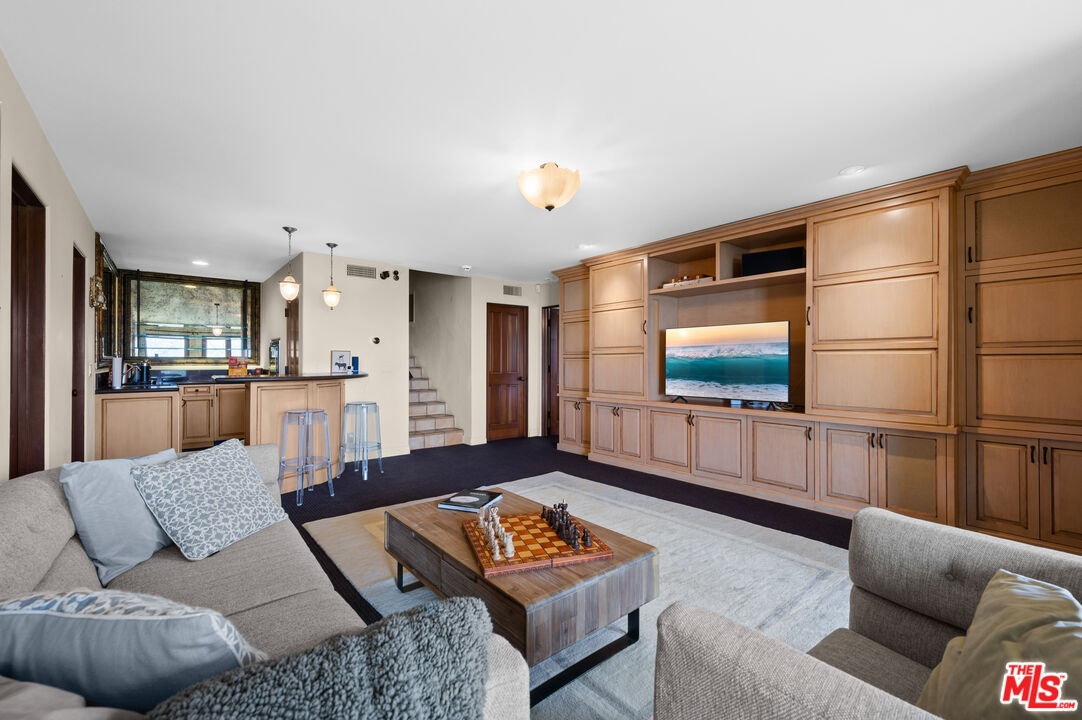 3854 Rambla Orienta Malibu, CA 90265 - Photo 22 of 33 a living room with furniture and a flat screen tv