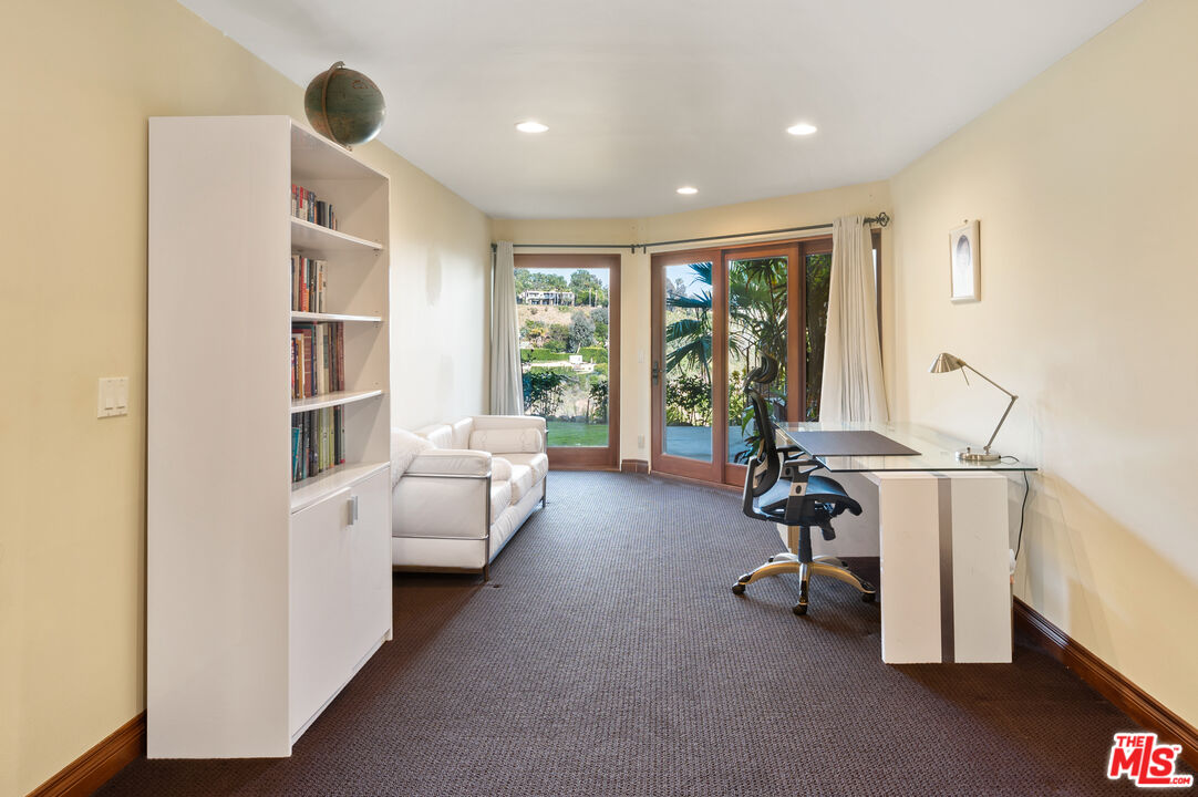 3854 Rambla Orienta Malibu, CA 90265 - Photo 25 of 33 a view of a livingroom with workspace and windows
