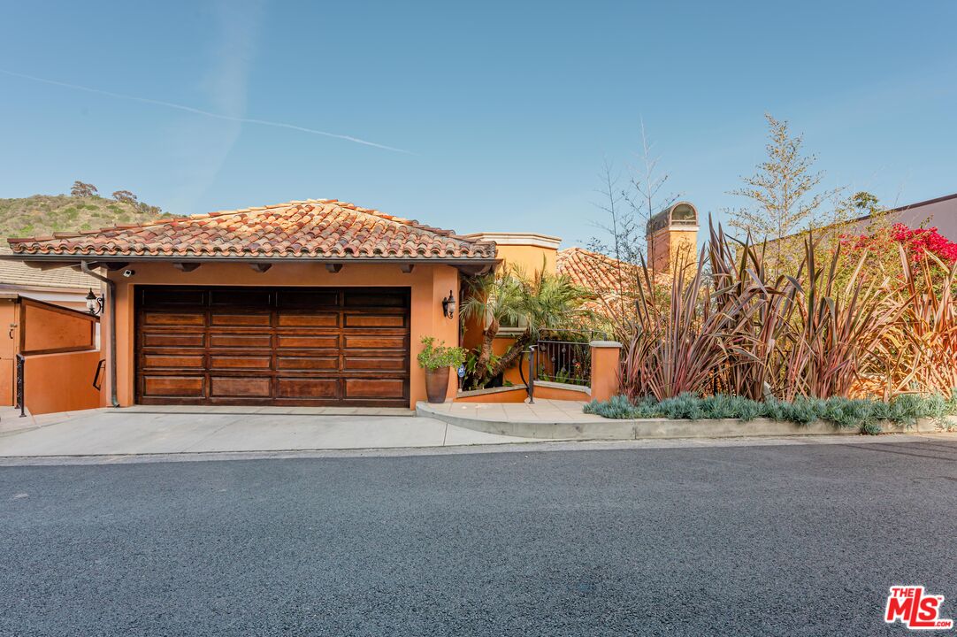 3854 Rambla Orienta Malibu, CA 90265 - Photo 28 of 33 a view of a house with a garage