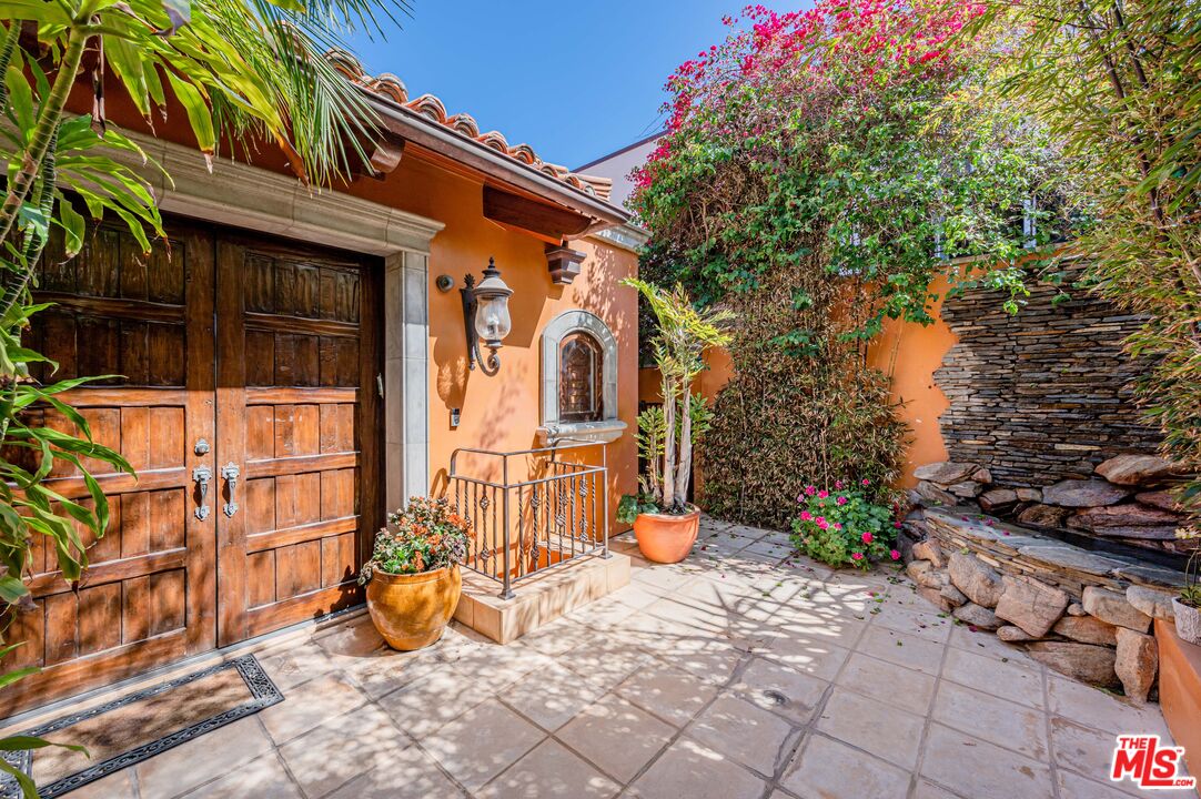 3854 Rambla Orienta Malibu, CA 90265 - Photo 3 of 33 a view of a brick house with many windows