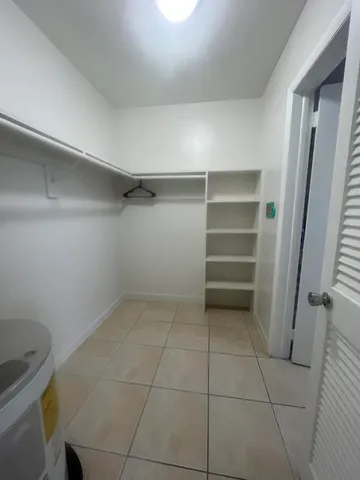 a view of an empty walk in closet