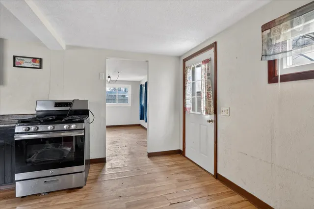 a kitchen with a stove and a refrigerator