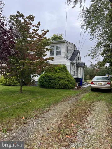 a view of a house with a back yard