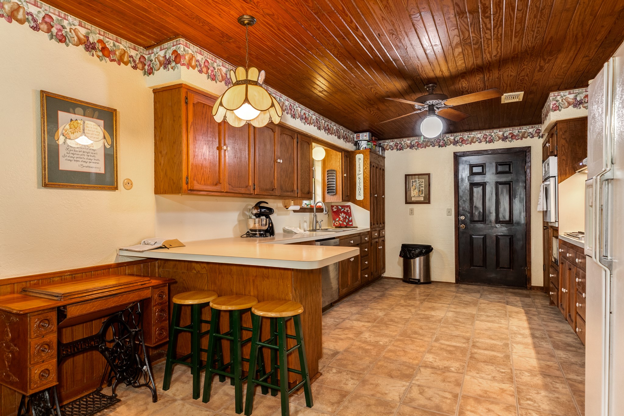 4821 County Road 288 Angleton, TX 77515 - Photo 15 of 35 a kitchen with stainless steel appliances a sink a refrigerator and cabinets