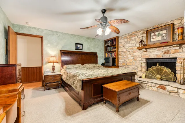 a bathroom with a sink a mirror and a shower