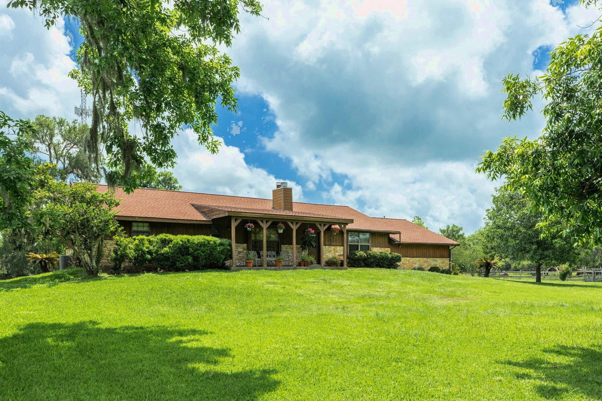 4821 County Road 288 Angleton, TX 77515 - Photo 2 of 35 a front view of house with yard and trees