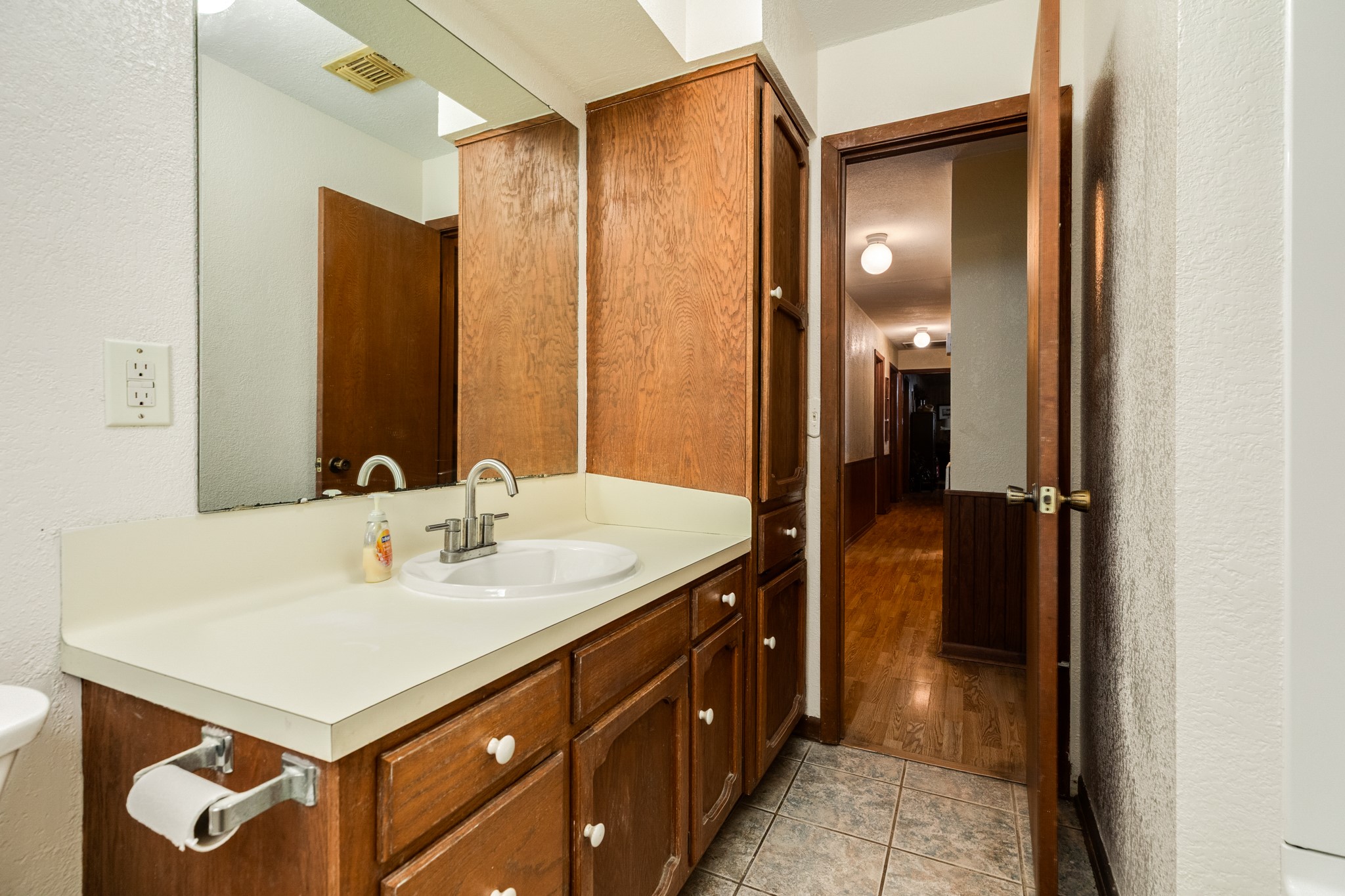 4821 County Road 288 Angleton, TX 77515 - Photo 25 of 35 a bathroom with a sink and a mirror