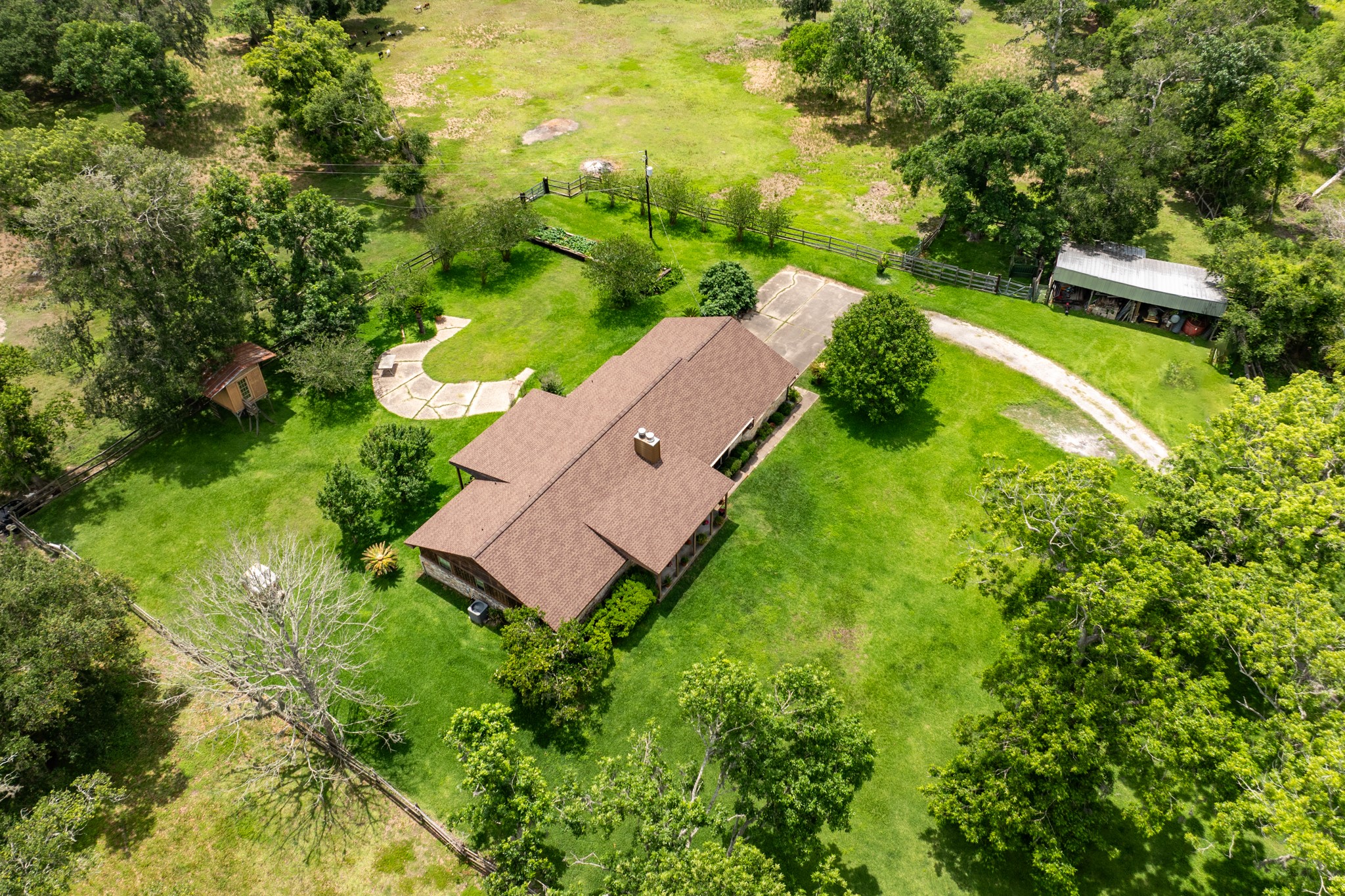 4821 County Road 288 Angleton, TX 77515 - Photo 28 of 35 an aerial view of a house with a yard and lake view