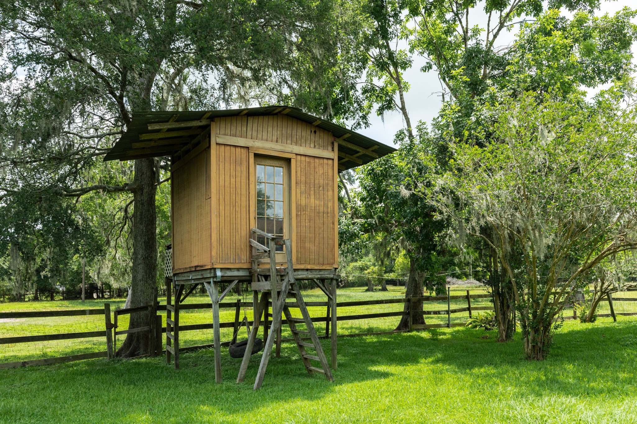 4821 County Road 288 Angleton, TX 77515 - Photo 31 of 35 a yellow house with trees in front of it
