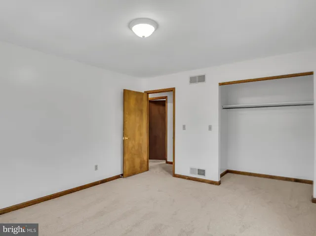 a bathroom with a sink mirror and toilet
