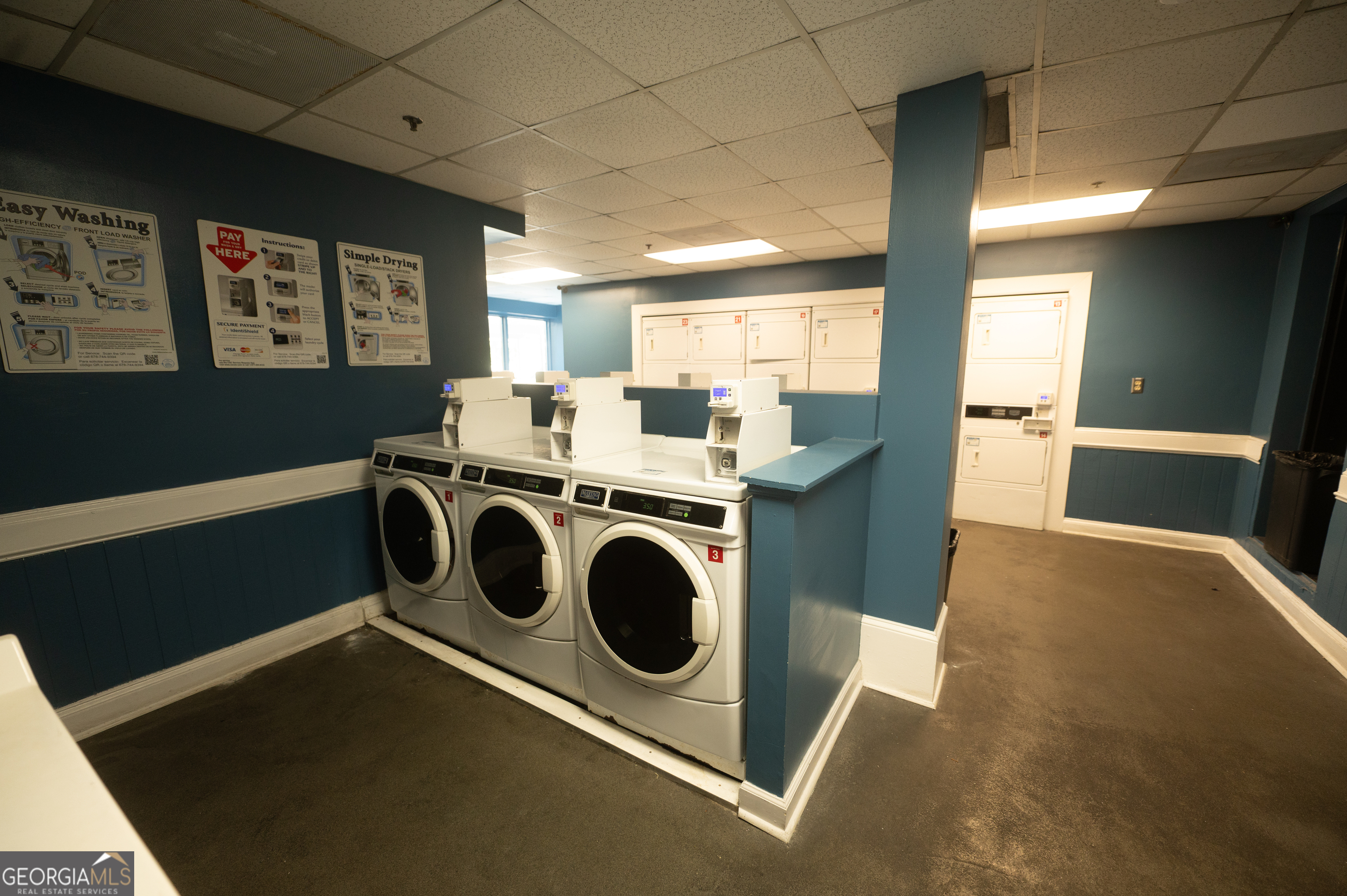 620 Peachtree Street Northeast, Unit 1501 Atlanta, GA 30308 - Photo 13 of 18 a utility room with dryer and washer