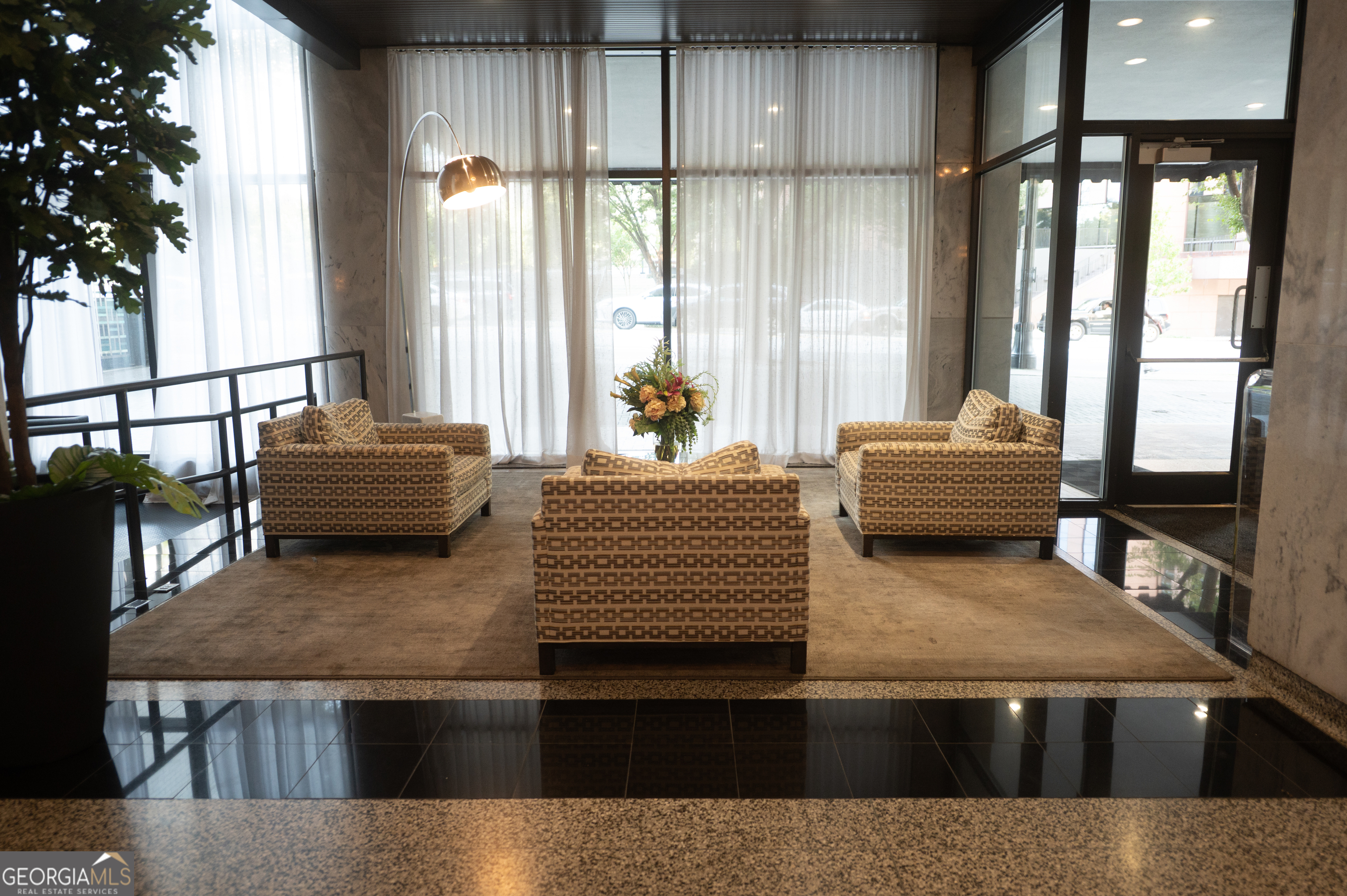 620 Peachtree Street Northeast, Unit 1501 Atlanta, GA 30308 - Photo 3 of 18 a living room with furniture and a window