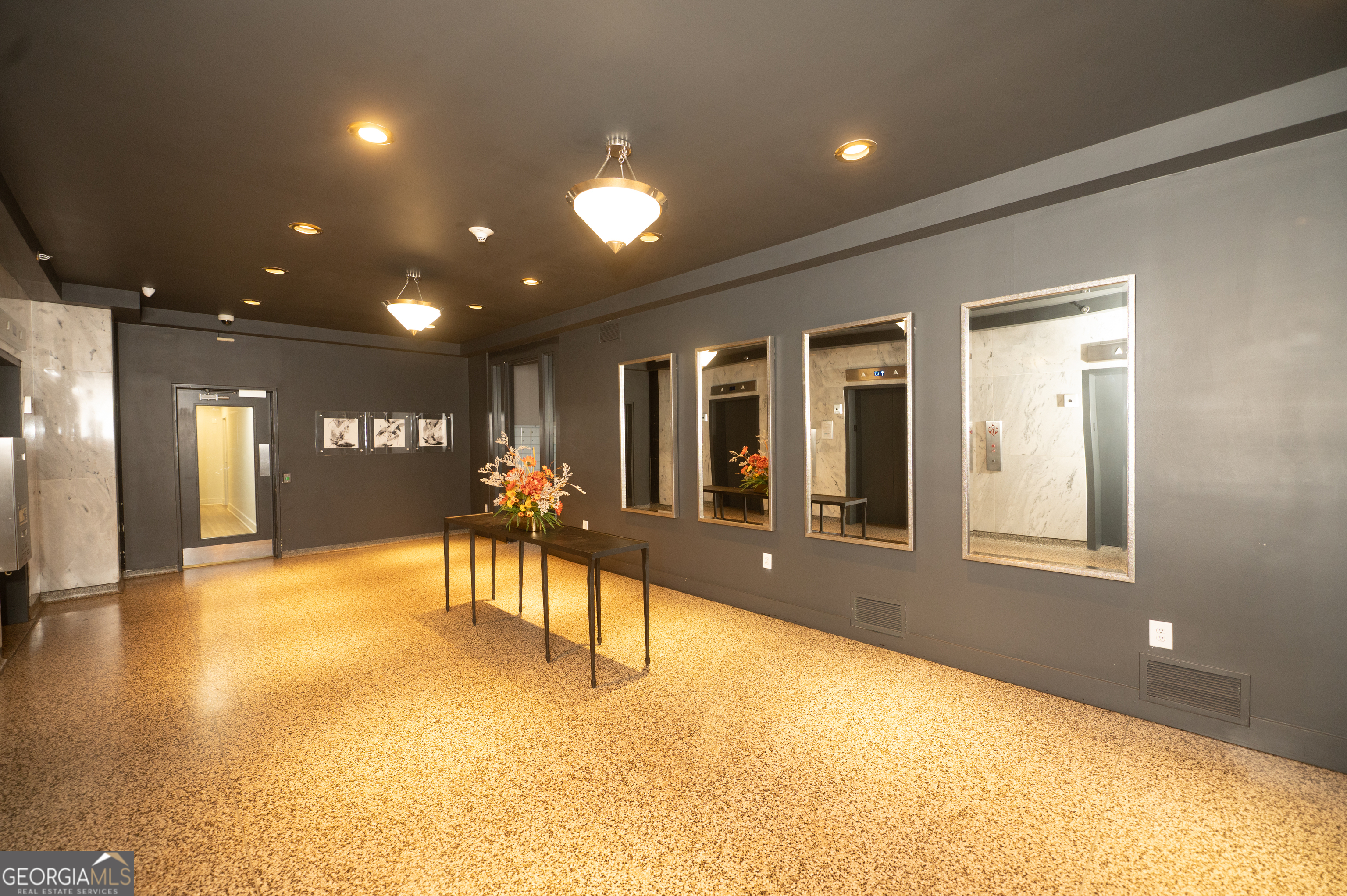 620 Peachtree Street Northeast, Unit 1501 Atlanta, GA 30308 - Photo 5 of 18 a view of a lobby with gym equipment