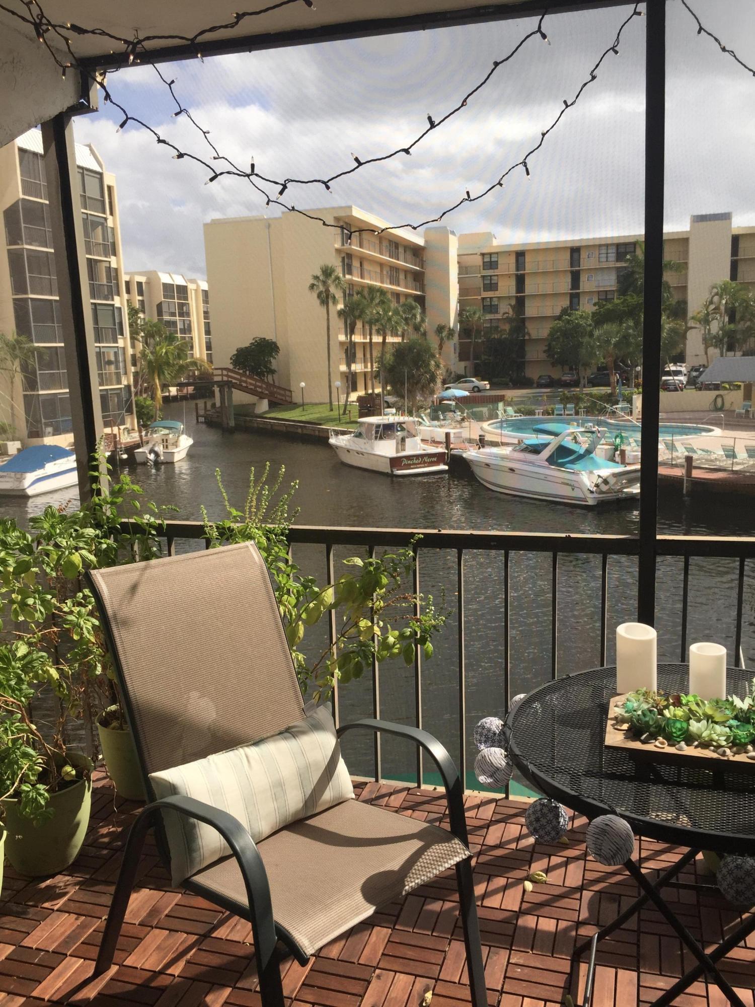 10 Royal Palm Way, Unit 2030 Boca Raton, FL 33432 - Photo 16 of 26 a view of a chairs and table in a patio