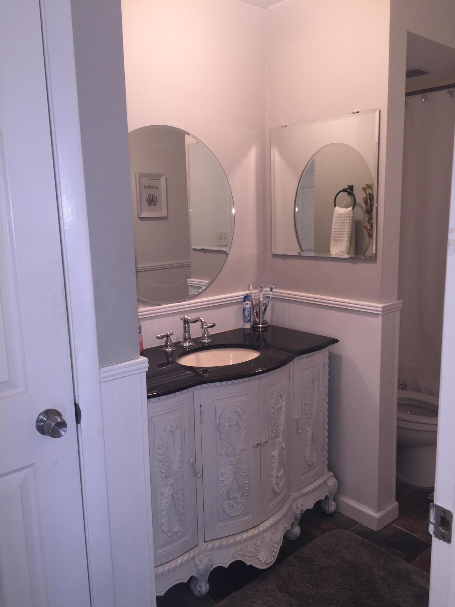 10 Royal Palm Way, Unit 2030 Boca Raton, FL 33432 - Photo 20 of 26 a bathroom with a sink and a mirror