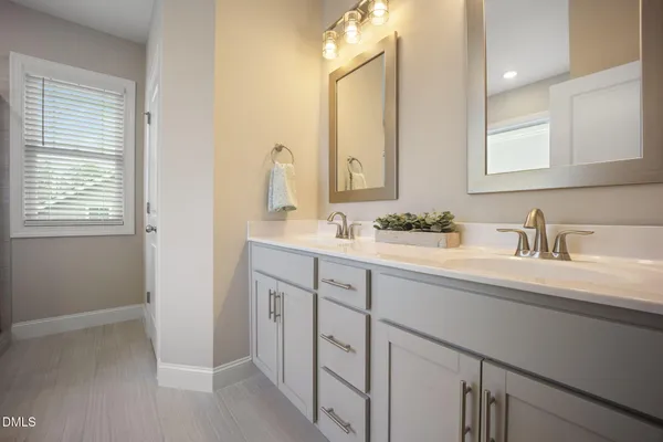 a bedroom with a bed and cabinets