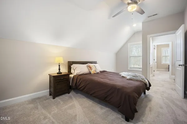 a bedroom with bed and window