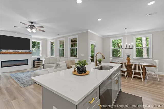 a dining room with furniture a window and a flat screen tv