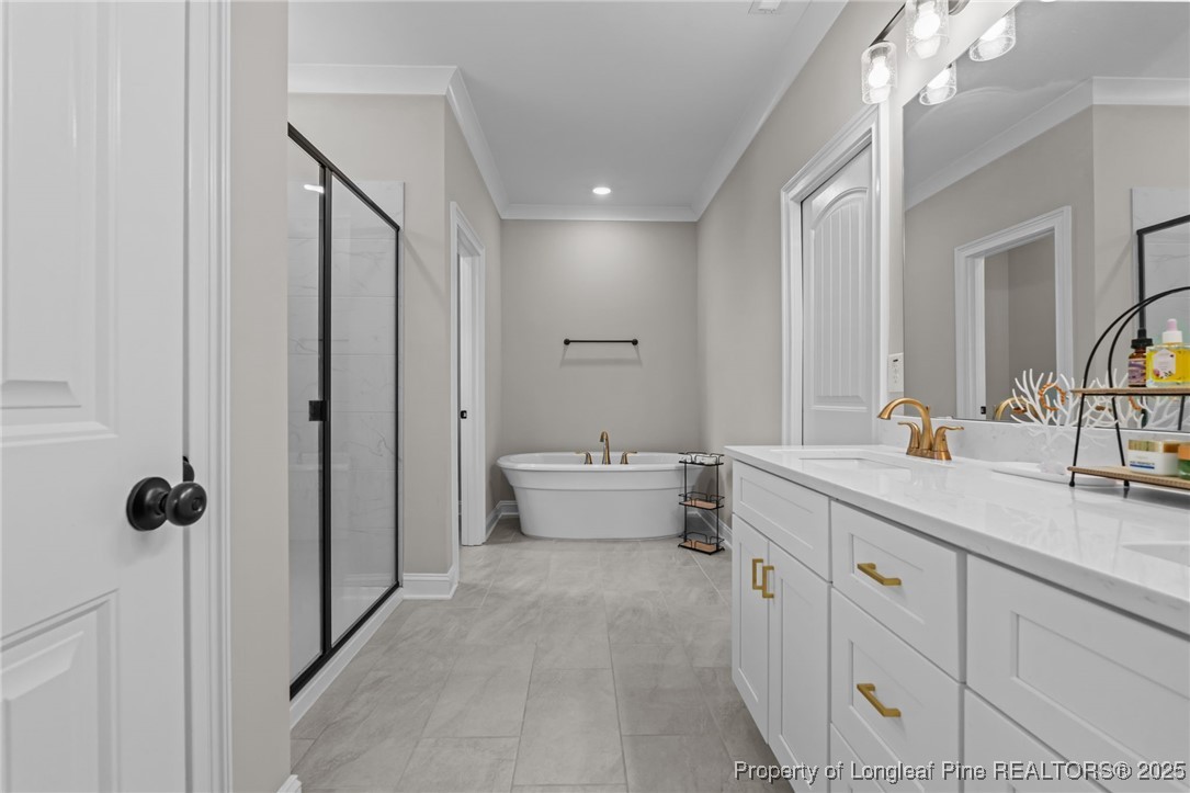 912 Sunset Drive Carthage, NC 28327 - Photo 19 of 41 a spacious bathroom with a double vanity sink mirror and toilet