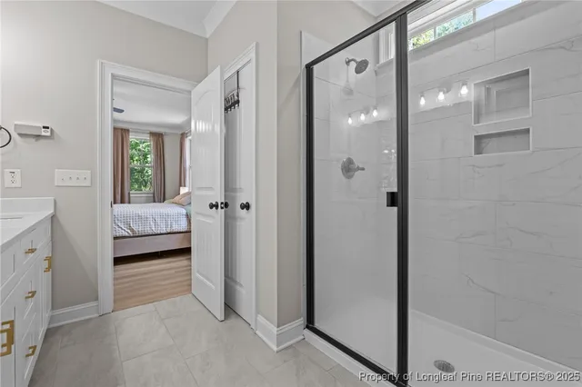 a bathroom with a double vanity sink and mirror