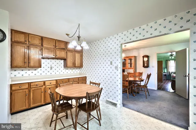 a kitchen with stainless steel appliances a stove and a sink