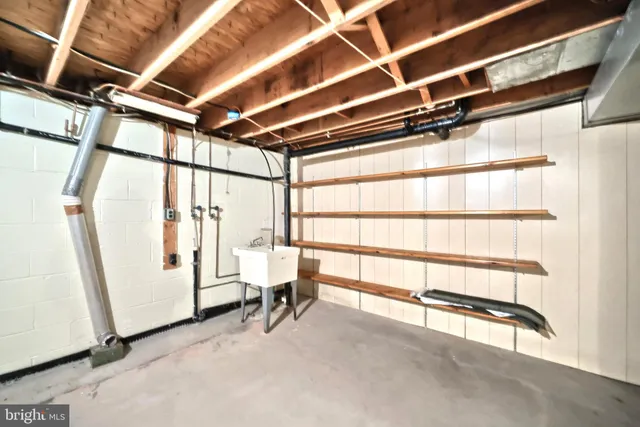 an aerial view of a house with a yard and lake view